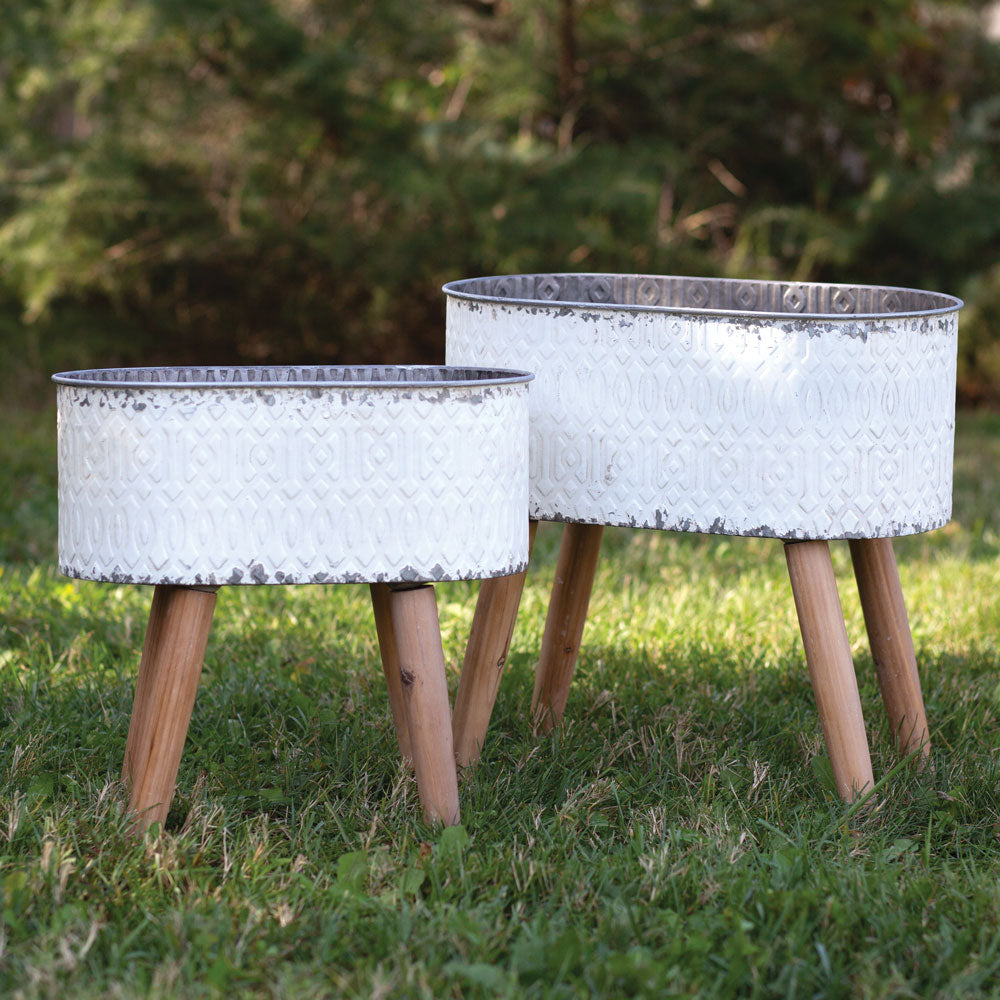 Set of Two Embossed Metal Planters with Wood Legs